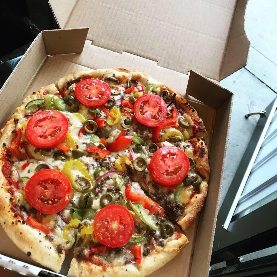 Pepperoni pizza with generous toppings at Roma's Pizzeria Crescent Heights Calgary